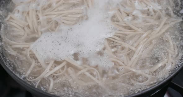 Cook with japanese soba in the kitchen