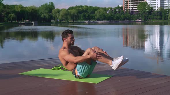 Handsome Shirtless Man Doing Criss Cross Abdominal Crunches