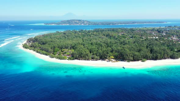 Luxury birds eye copy space shot of a white sand paradise beach and aqua blue ocean background 