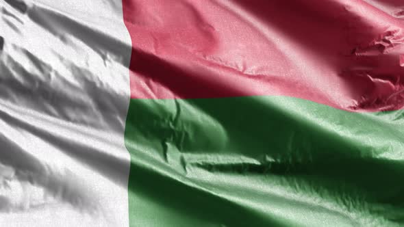 Madagascar textile flag waving on the wind. Slow motion. 20 seconds loop.