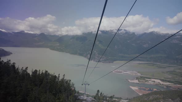 Gondola and metal ropes with beautiful spring view of Howe sound and mountains