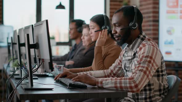 African American Man Working at Call Center Office