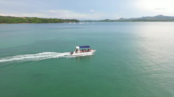 aerial follow shot of a small motor boat off Madagascar