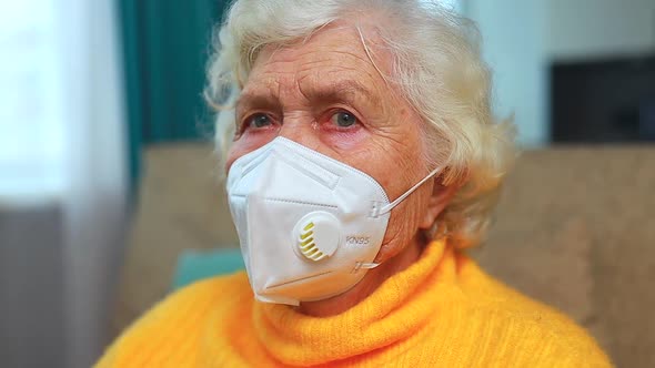 Senior Woman Wearing Face Mask During Corona Virus at Home