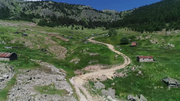 Green plateau and houses.