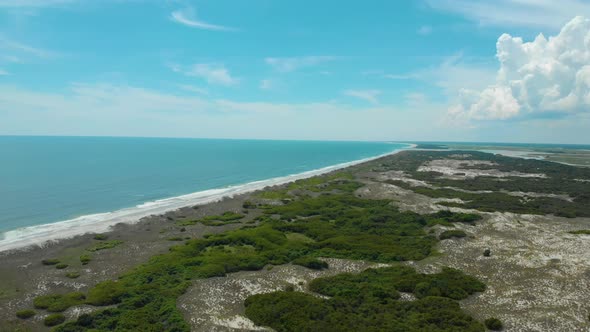 drone shots of the sand dunes and marsh lands at the coast