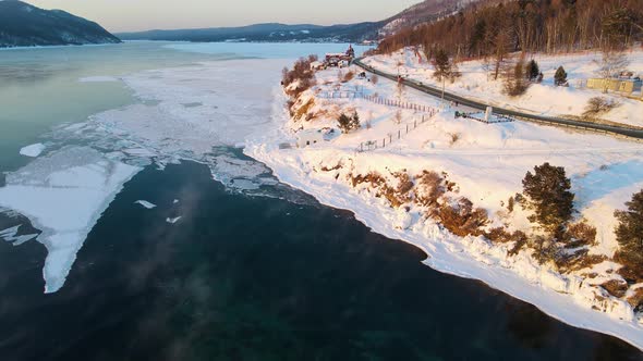 Angara River near Lake Baikal in winter. Cinematic foootage on frosty evening