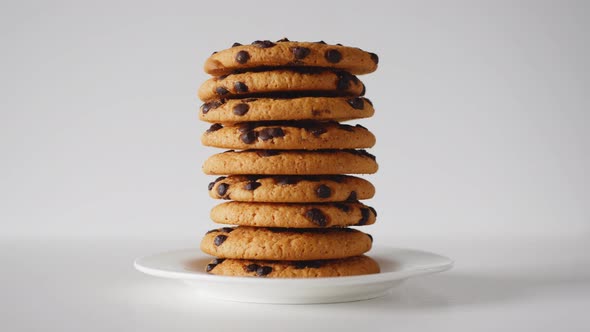 Stack of Oatmeal Chocolate Chip Cookies Sprout in a Plate on a White Table