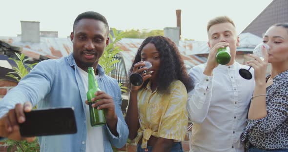 Smiling Multiethnic Youth which Making Selfie During Mates Party on the Terrace at Summertime