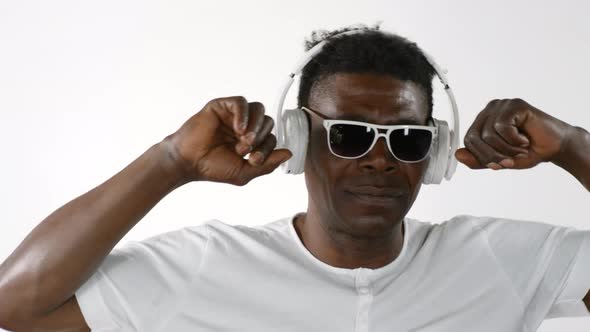 Hipster African Man Listening to Music and Dancing