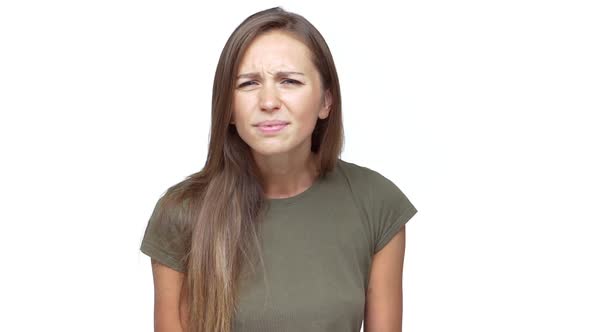 in Slow Motion Lady with Long Brown Hair Expressing Disgust Saying No with Facial Expresions Over