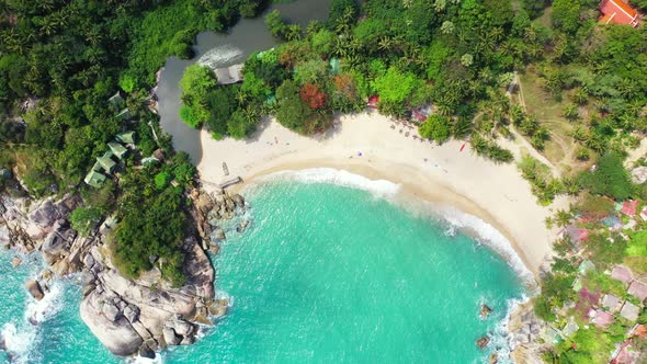 Aerial scenery of exotic tourist beach vacation by aqua blue water and clean sand background of a da