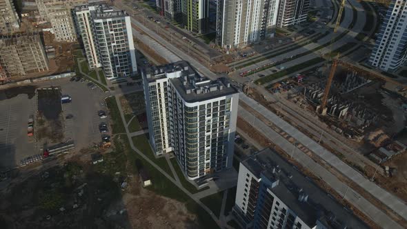 Construction of a modern city block. Multi-storey buildings