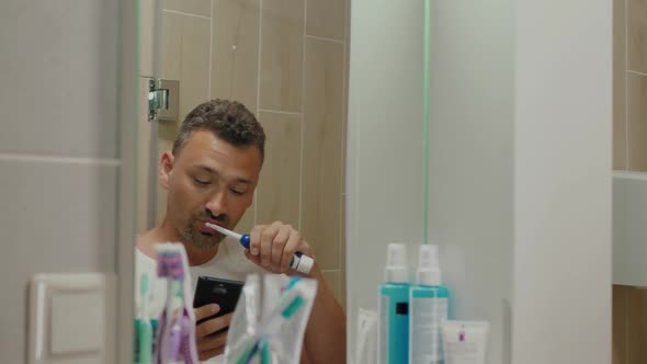 Handsome Guy Brushes Teeth