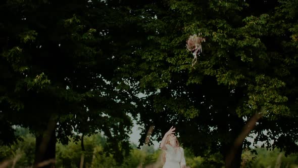 Carefree Woman Tosses Bouquet Up