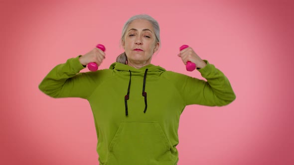 Senior Old Granny Sporty Woman Working Out Lifting Pink Dumbbells Practicing Pilates Healthcare