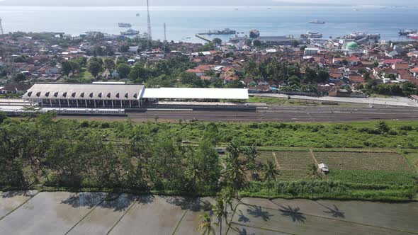 Aerial view of train stasiun with ferry port background in Banyuwangi, Indonesia