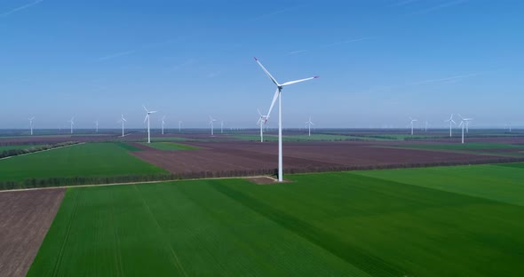 4K aerial wiev of windmills farm. Modern wind turbines.