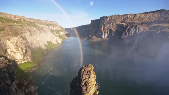 Panning the Snake River Canyon past rainbow to Shoshone Falls