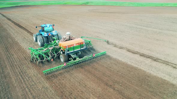 Sowing Machine Works on a Field