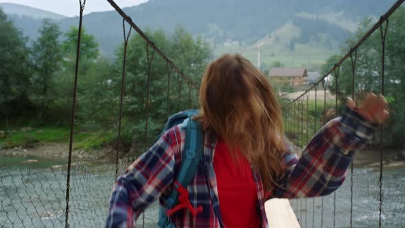 Traveler Dancing Mountain Hike on River Bridge