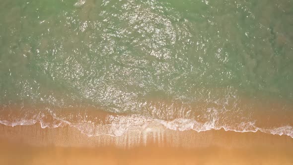 Aerial view of Phuket sea and sand beach in summer season Amazing sea beach with ocean wave foams