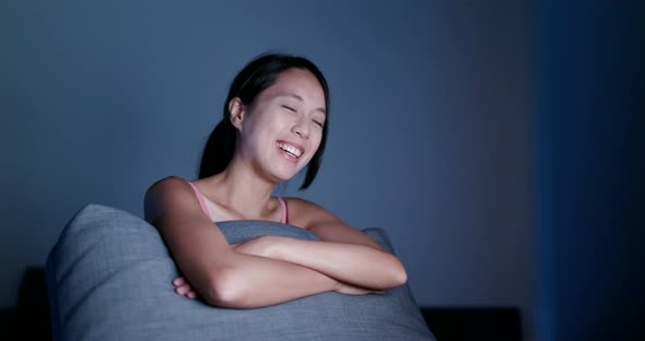 Woman watch on computer at night