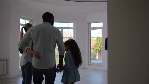 Real Estate Agent Showing Family Room in House