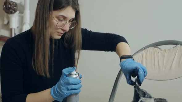 Woman Spraying Cleaning Liquid on Her Shoes