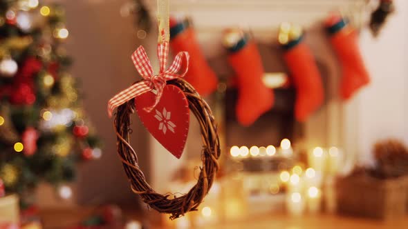 Christmas grapevine wreath with ribbon hanging on window