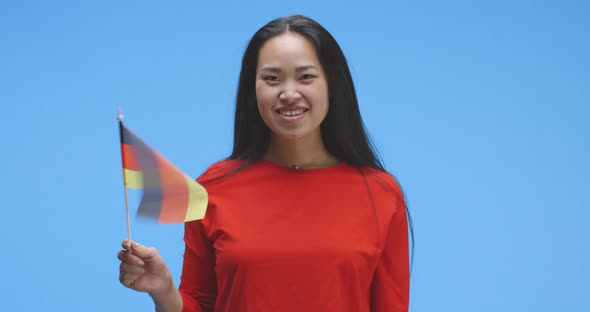 Young Woman Waving with German Flag