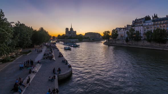 Rear View of Notre Dame De Paris Cathedral Day To Night Timelapse After Sunset