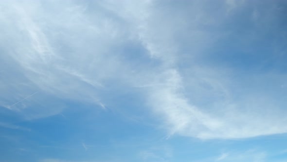 4K UHD : Time lapse of beautiful blue sky with clouds background,