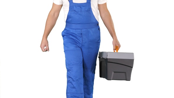 Builder with tool case walking on white background.