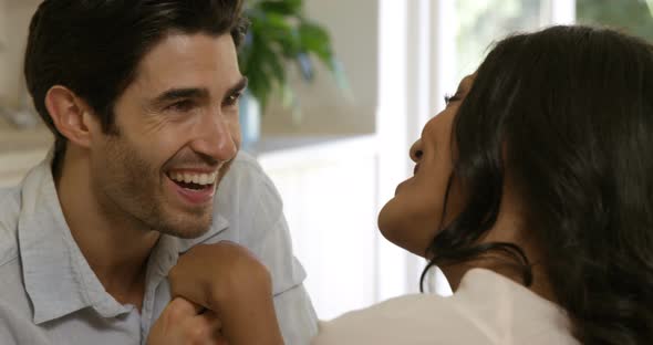 Young man kissing a woman on hand