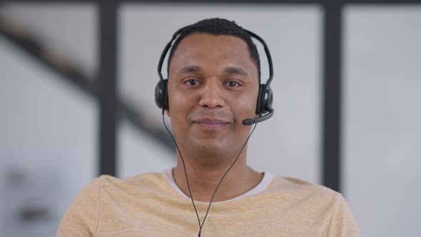 Video Chat POV of Smiling African American Man Waving Goodbye Taking Off Earphones and Sighing