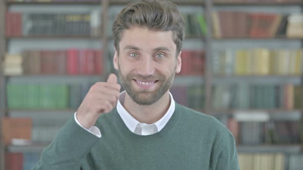 Happy Young Man Showing Thumbs Up