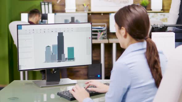 Female Architect Making 3d Building Models on Computer