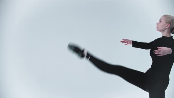 Gymnastics  Young Woman Walks and Raising High Her Legs