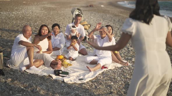 Laughing Happy Asian Family and Caucasian Man Guessing Words As Woman Gesturing in Slow Motion