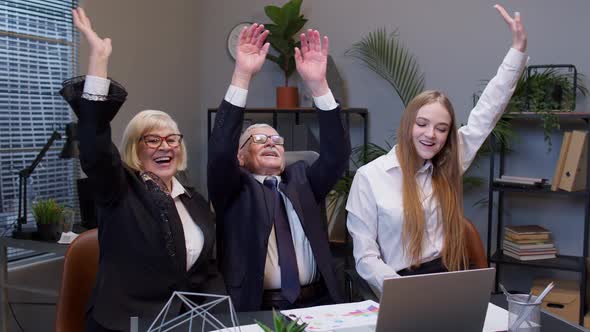 Collegues in Suits Showing Victory Gesture Give Five Celebrating Success Good Results in Office