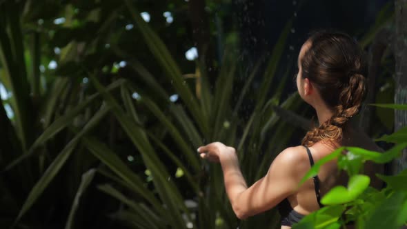 Girl Turns on Refreshing Shower After Long Swimming in Ocean