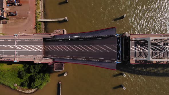 Top View Of A Bascule Bridge Opening Over Noord River In Alblasserdam, Netherlands. aerial