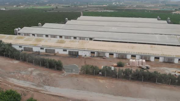 Aerial views of pigs farms in fields.