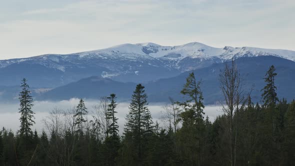 Panoramic View on the Snowy Mountain Ridge