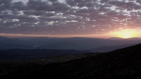Sunset sky over mountain ridge in highland
