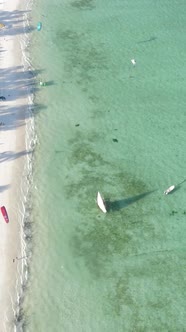 Vertical Video Boats in the Ocean Near the Coast of Zanzibar Tanzania