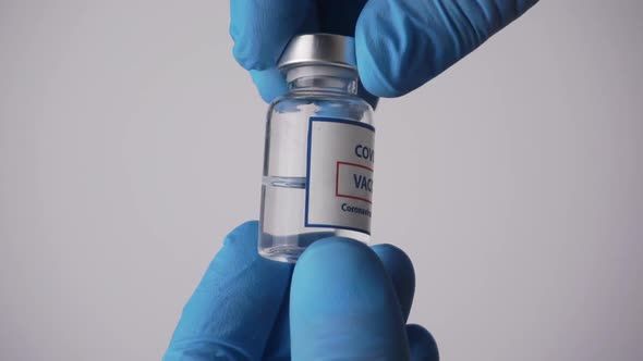 Vaccine for Coronavirus Covid in the Hand of a Doctor in a Medical Laboratory