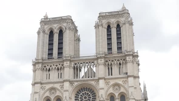 Notre-Dame Cathedral located in France capital Paris slow tilt 4K 2160p UltraHD footage - Famous Not