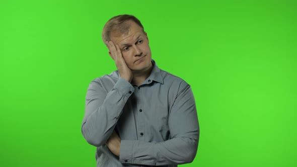 Sleepy Bored Guy Looking at Camera Not Interested in Communication, Man on Chroma Key Background